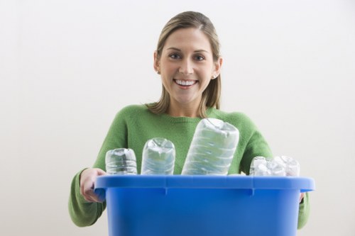 Workers loading a medium van with office clear-out waste